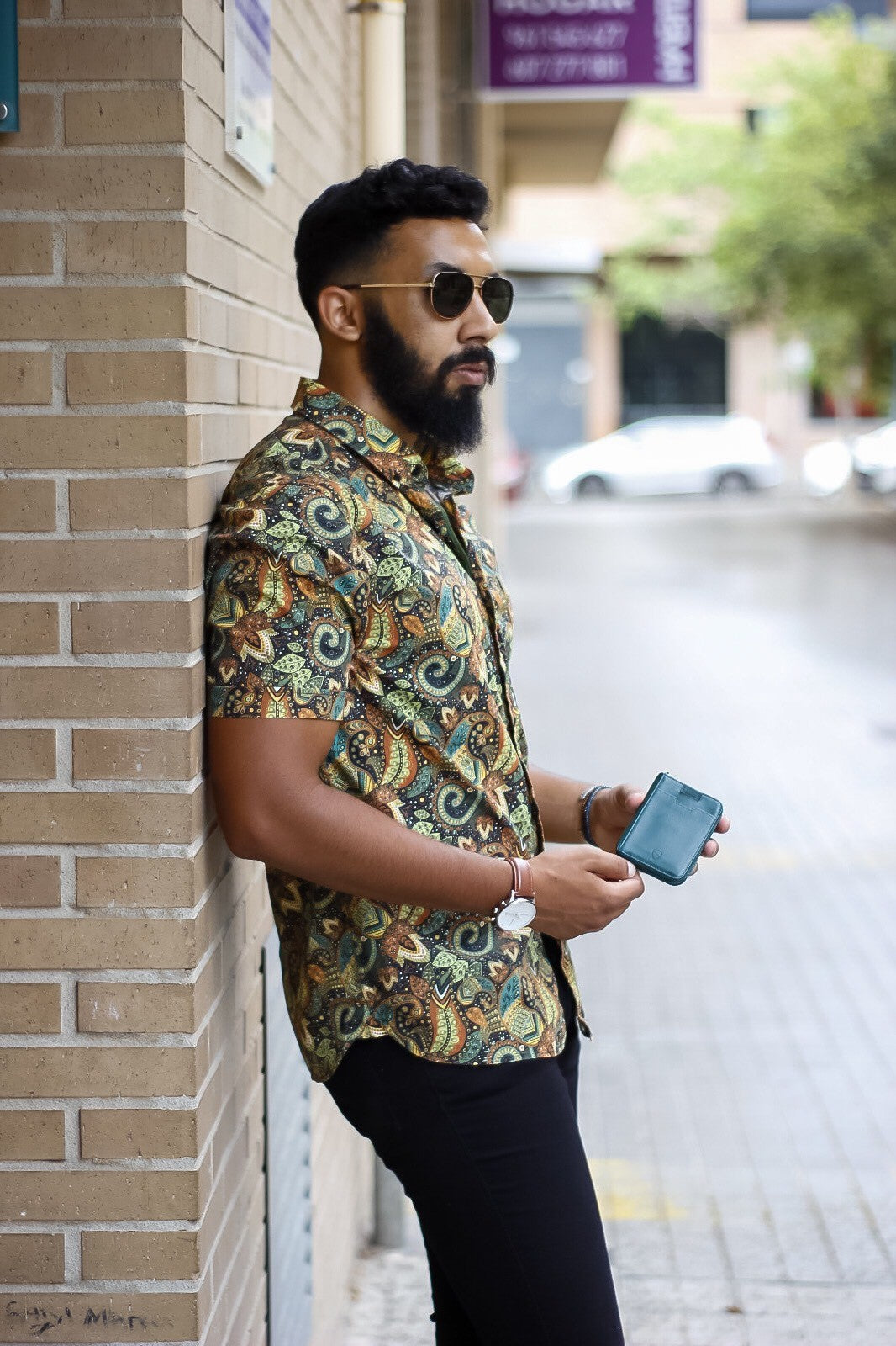 Man holding Vaultskin Notting Hill in Alpine Green in his hands