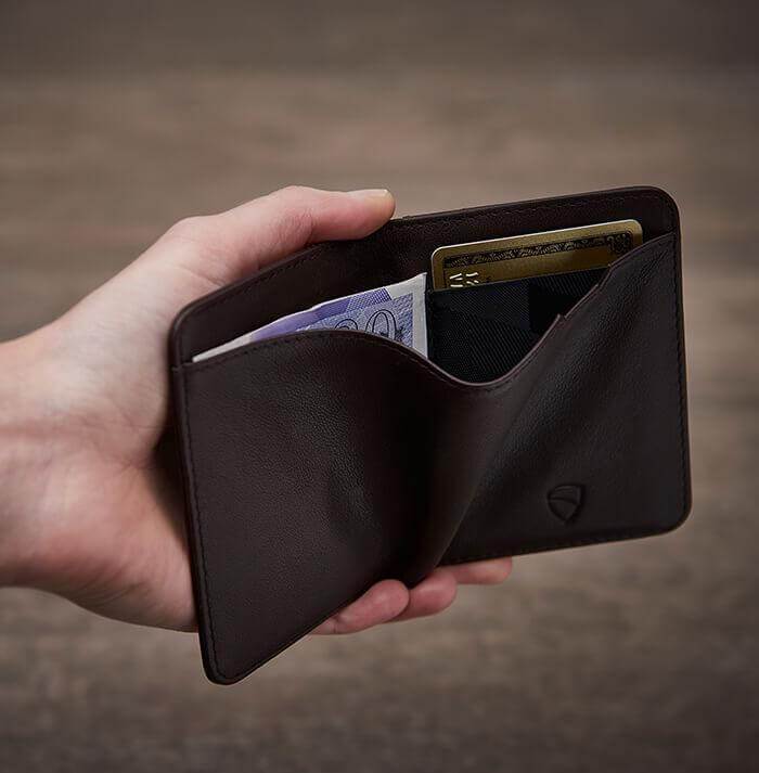 Precision-engineered brown leather purse by Vaultskin CITY, offering a slim, space-efficient design with RFID safety