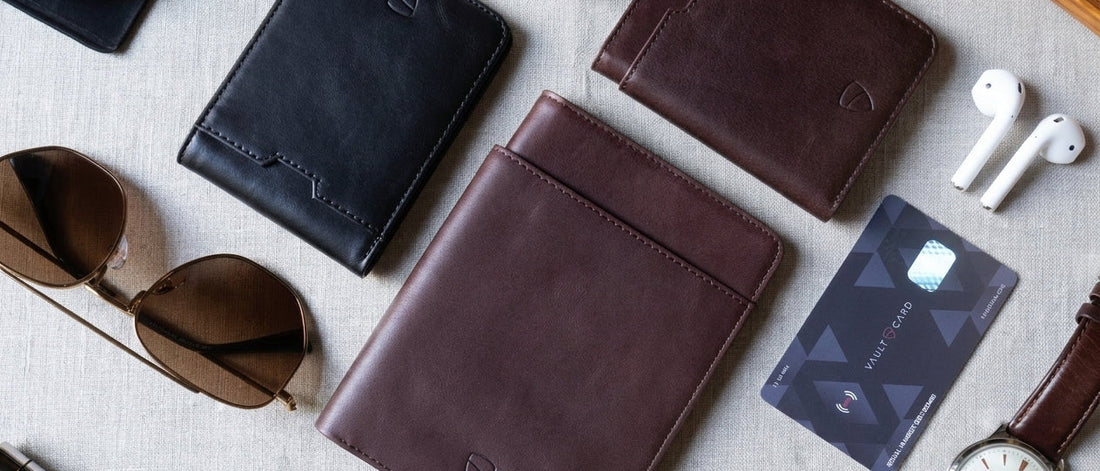 Vaultskin  wallets on table with props and RFID card. 