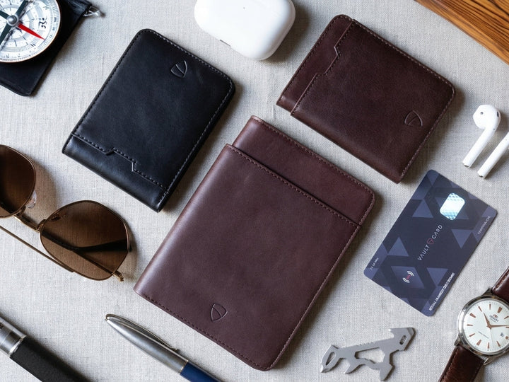 Vaultskin  wallets on table with props and RFID card. 