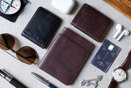 Vaultskin  wallets on table with props and RFID card. 