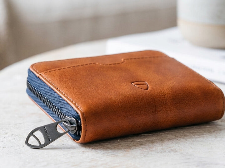 Mayfair zipper wallet in cognac leather on the table