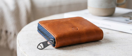 Mayfair zipper wallet in cognac leather on the table