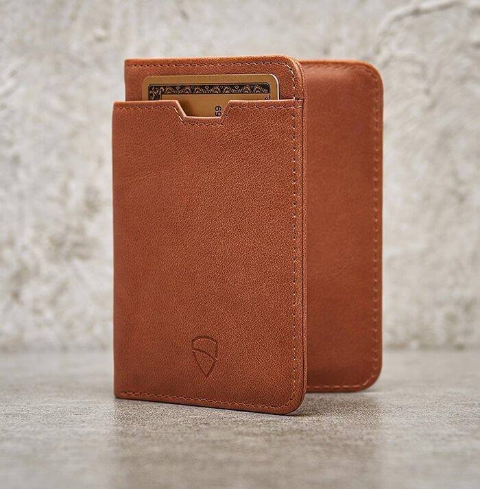 Compact and elegant, the cognac leather CITY wallet by Vaultskin features an easy-access exterior card slot and integrated RFID protection